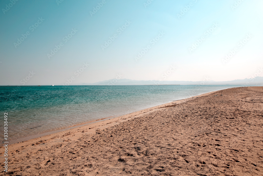 Summer landscape of sea and sand with blue sky Summer landscape of sea and sand with blue sky