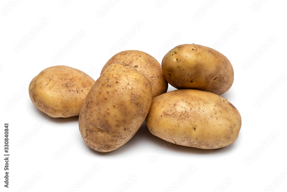 raw dirty potatoes on a white background raw dirty potatoes on a white background