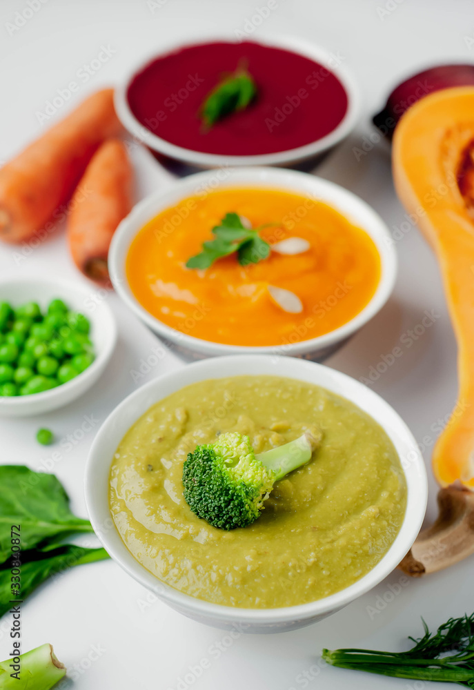 Set of vegetable soups. Soup from broccoli, spinach, green peas. Pumpkin and carrot soup. beetroot - carrot soup on a white background isolated Set of vegetable soups. Soup from broccoli, spinach, green peas. Pumpkin and carrot soup. beetroot - carrot soup on a white background isolated