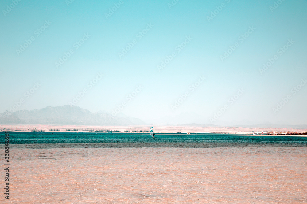 Summer landscape of sea and sand with blue sky 