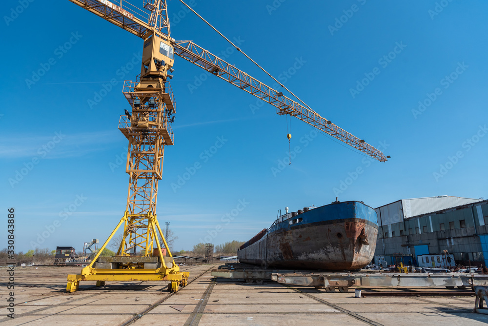 shipyard workers are working in the hangar to build a new ship shipyard workers are working in the hangar to build a new ship