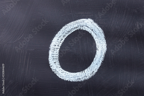 Letter O of the alphabet written with chalk