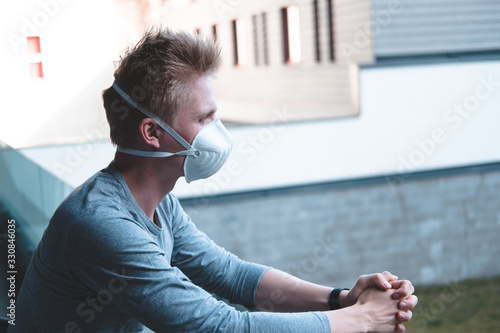 Wallpaper Mural Man wearing FFP3 face mask respirator against flu  Torontodigital.ca