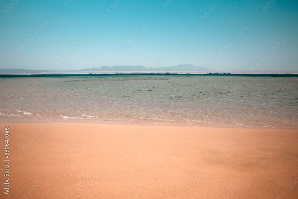 Summer photo of beach with sea and sunny warm day 