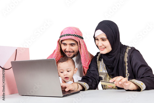 Happy muslim family online shopping