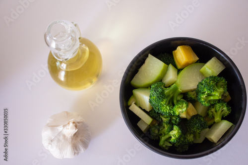 Delicious gourmet dish with vegetables, noodles and olive oil on white background