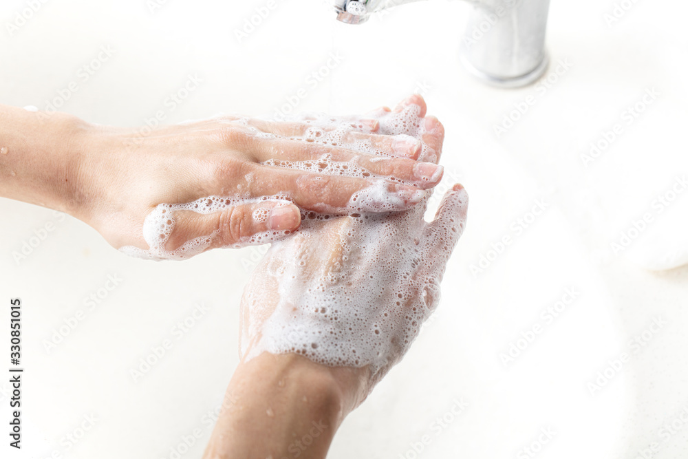 Fototapeta premium Washing hands. daily personal care against viruses, bacteria, microbes.