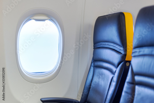 Empty airplane. Passengers free airplane, cancelled flight. Free window seat. Cancelled flight, no travel, stop airline for prevention coronavirus pandemic. COVID 19 virus outbreak quarantine