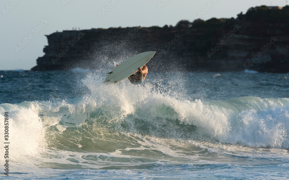 Fototapeta premium Surfer riding a large wave, SydneyAustralia