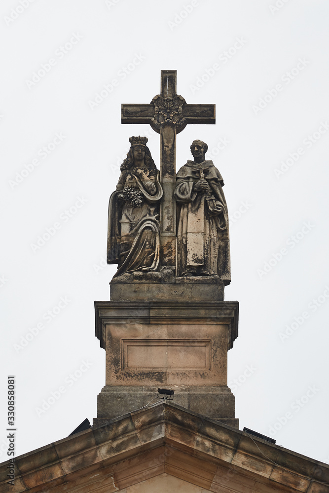 Detail on the top of a catholic church with cross Detail on the top of a catholic church with cross