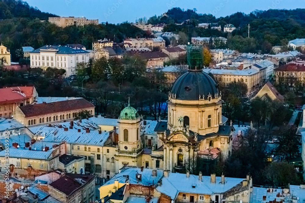 View on Dominican cathedral and historic center of the Lviv at sunset. View on Lvov cityscape from the town hall