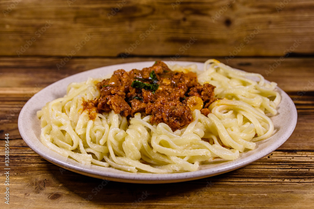 Pasta with bolognese sauce in a ceramic plate Pasta with bolognese sauce in a ceramic plate