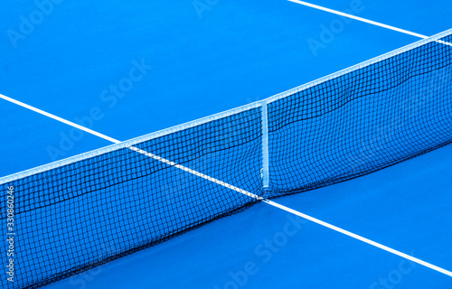 Blue paddle tennis net and hard court. Tennis compettion concept © Augustas Cetkauskas