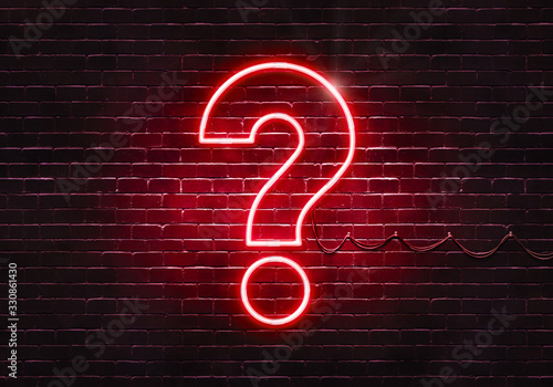 Neon sign on a brick wall in the shape of a question mark.(illustration series) photo