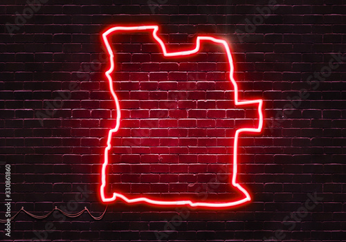 Neon sign on a brick wall in the shape of Angola.(illustration series)