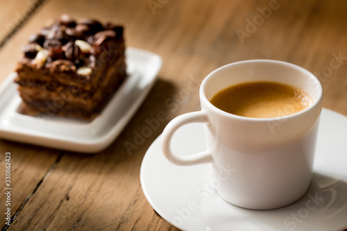 cup of coffee with slice of cake