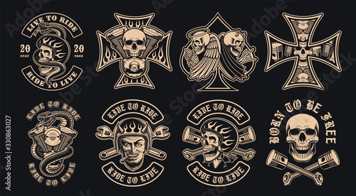 Set of black and white biker emblems on a dark background. photo