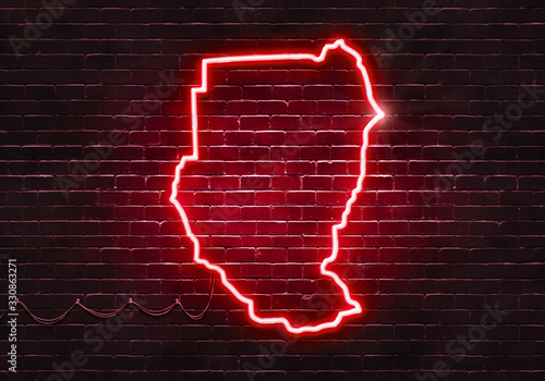 Neon sign on a brick wall in the shape of Sudan.(illustration series)