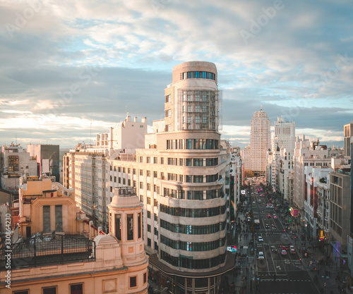 Gran via street with traffic and people and Callao Square, main shopping street in Madrid. Spain, Europe photo