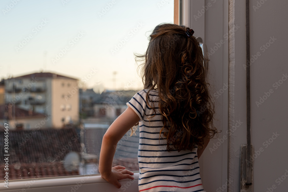 cute little girl is spending time home because of the quarantine imposed by the italian government for the coronavirus cute little girl is spending time home because of the quarantine imposed by the italian government for the coronavirus