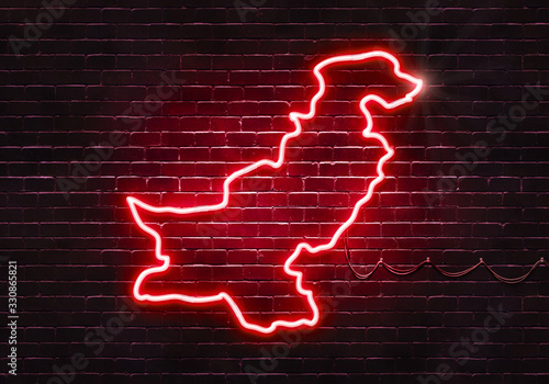 Neon sign on a brick wall in the shape of Pakistan.(illustration series)