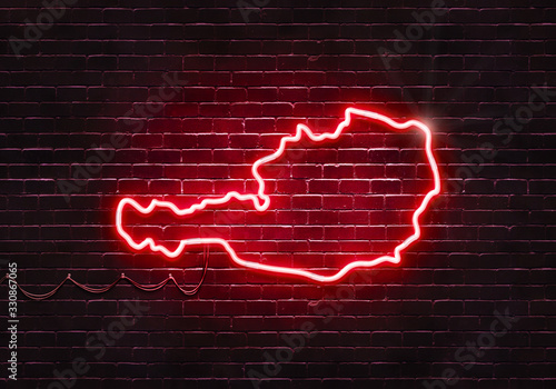 Neon sign on a brick wall in the shape of Austria.(illustration series)