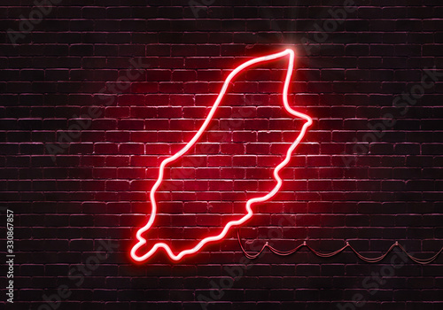 Neon sign on a brick wall in the shape of Isle of Man.(illustration series)