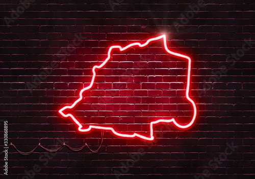 Neon sign on a brick wall in the shape of Vatican City.(illustration series)