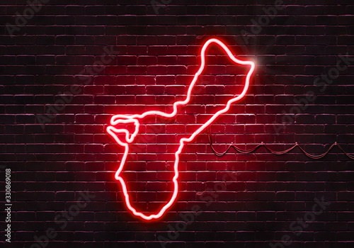 Neon sign on a brick wall in the shape of Guam.(illustration series)