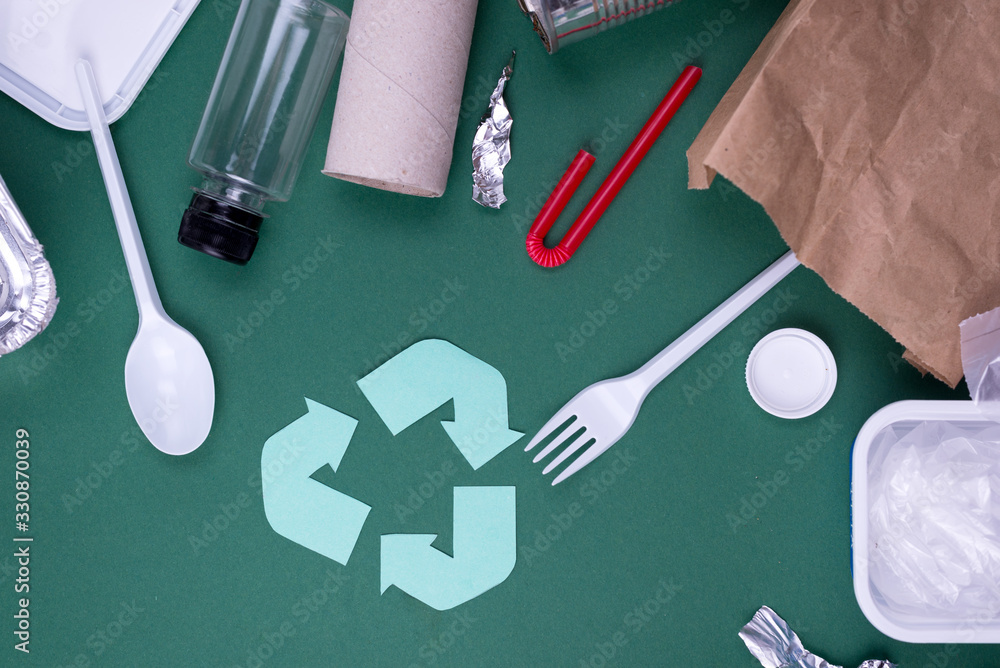 Reuse reduce recycle flat lay concept with plastic, paper, and ...
