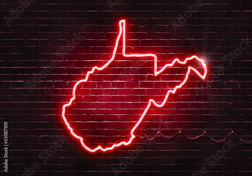 Neon sign on a brick wall in the shape of West Virginia.(illustration series)