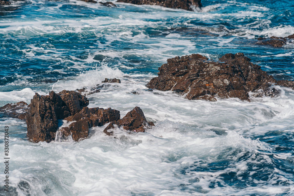 Naklejka premium Sea Wave and rock; natural background