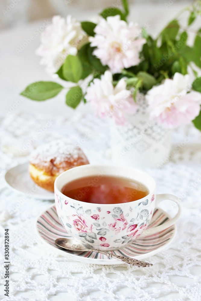 A tea party in the style of Shabby Chic. tea in the beautiful tea steam with a pattern A tea party in the style of Shabby Chic. tea in the beautiful tea steam with a pattern