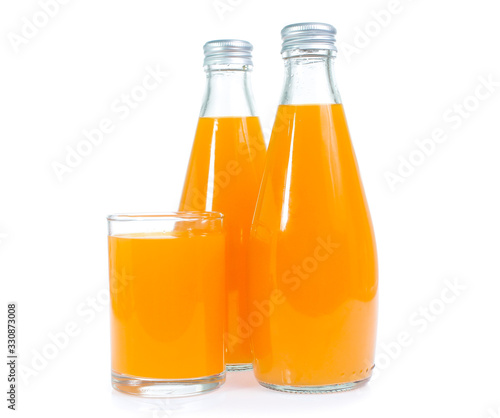 Orange juice in glass bottle isolated on white background