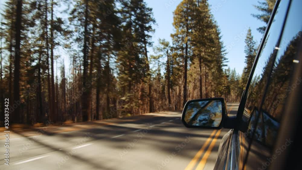 Following Shot of Black Vehicle Driven by Lady Along Yosemite Valley Roads Following Shot of Black Vehicle Driven by Lady Along Yosemite Valley Roads