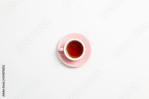 Obraz na płótnie Cup of black tea on white background. Flat lay, top view, copy space w salonie