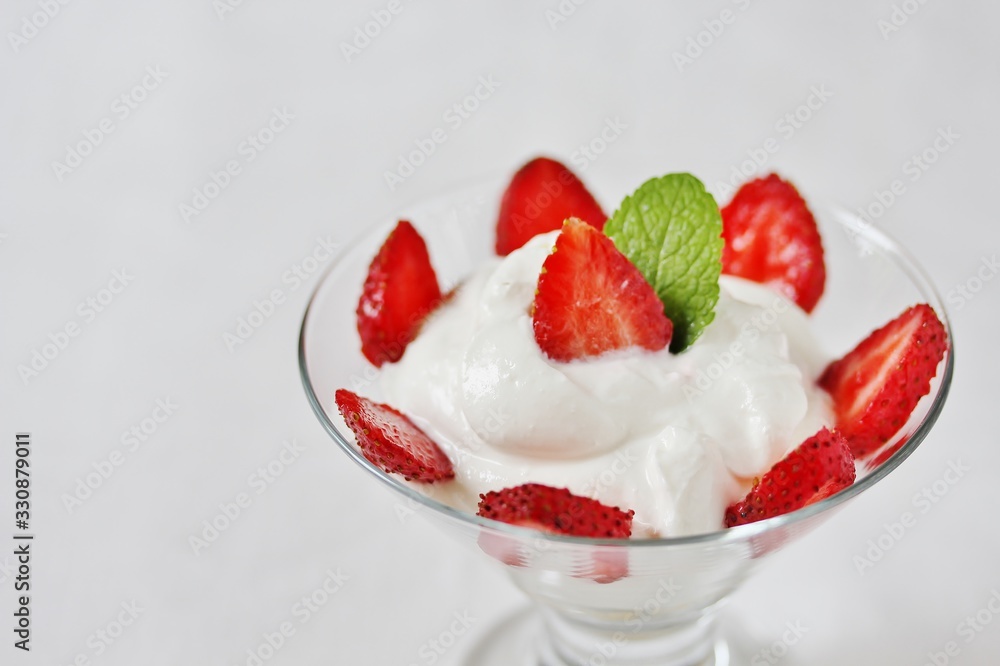 cheese cream. whipped curd cream with strawberries. Homemade cottage cheese is whipped with cream. Chamomile flowers. A useful dessert. On a light background. cheese cream. whipped curd cream with strawberries. Homemade cottage cheese is whipped with cream. Chamomile flowers. A useful dessert. On a light background.
