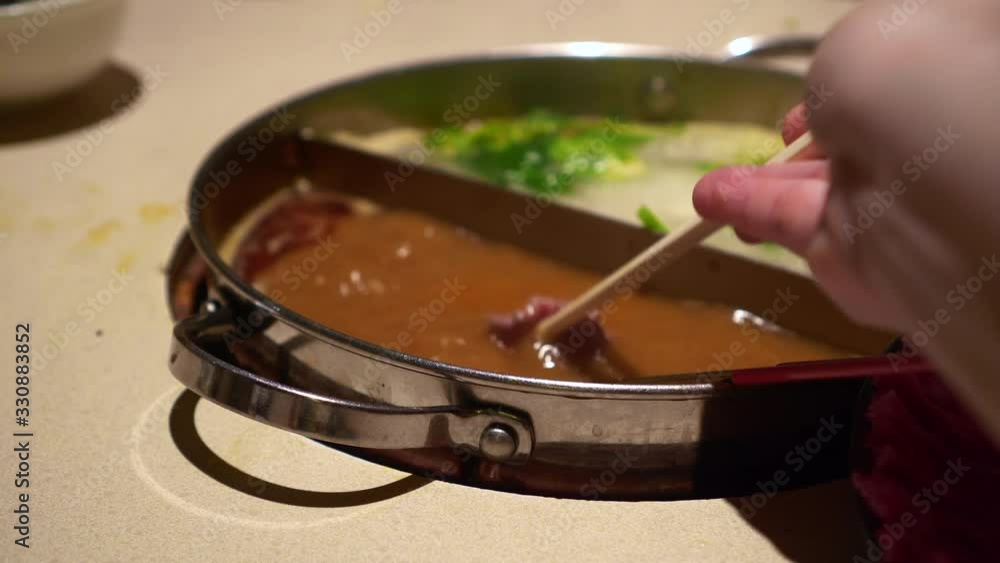 Beef meat slice eating in peanut hot pot soup Chinese winter food Beef meat slice eating in peanut hot pot soup Chinese winter food