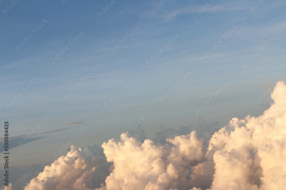 Dramatic cloudscape during sunrise from the airplane's window Dramatic cloudscape during sunrise from the airplane's window