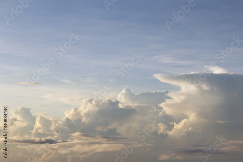 Dramatic cloudscape during sunrise from the airplane's window