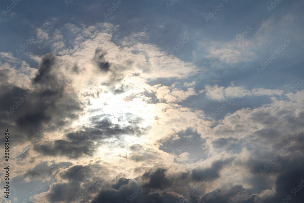 Dramatic and beautiful cloudscape with the sunlight and blue sky during the late afternoon