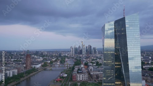 Dark Skyn over Moody European Central Bank ECB tower in Frankfurt am Main Germany from a drone at sunrise 4K photo