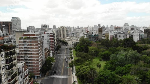 Aerial view of Las Heras park in Palermo, Buenos Aires. Drone flying over the street and slowly descending while flying forward photo