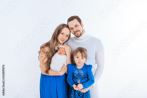 concept of healthy lifestyle, protection of children, shopping - baby in the arms of the mother and father. Woman and man holding a child. Isolated on white background. Copy space. Portrait of faamily