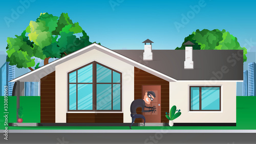 A thief sneaks into the house. The robber is trying to crack the door. Sign of a robbery. A surveillance camera recorded a thief. Security concept. 