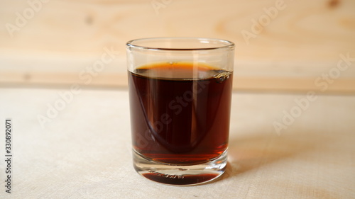Espresso Coffee shot with wooden background