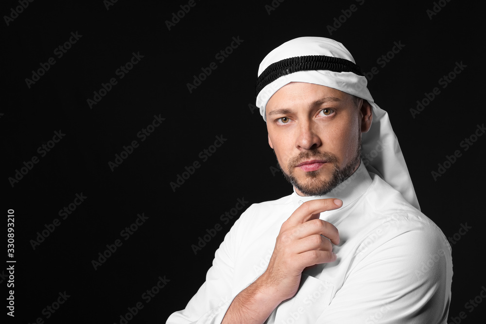 Handsome Arab man on dark background Handsome Arab man on dark background