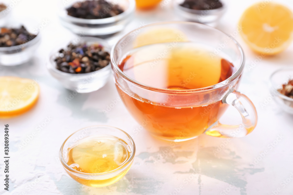 Cup of hot tea with honey on white background Cup of hot tea with honey on white background