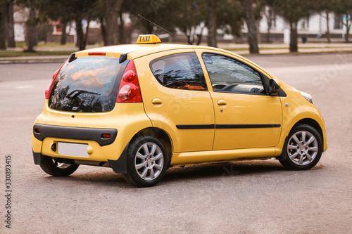 Modern taxi car on city road