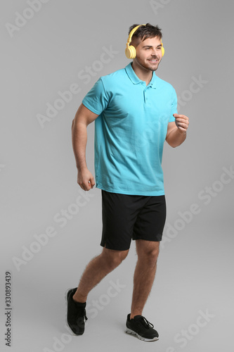 Sporty running young man on...